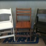 White Padded, timber & Black folding Chairs